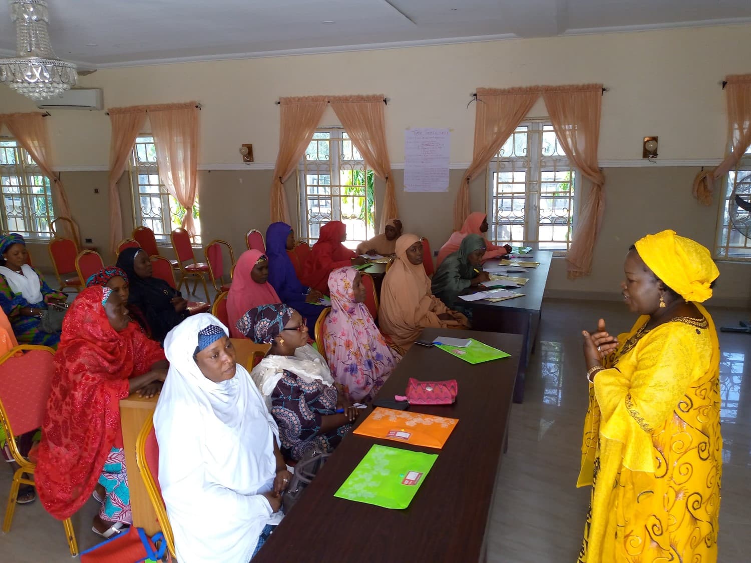 Woman leading a training session for community women